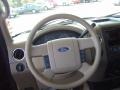 Tan 2004 Ford F150 XLT SuperCab Steering Wheel