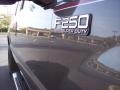 2004 Ford F250 Super Duty XLT SuperCab 4x4 Badge and Logo Photo