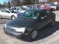 2005 Liquid Grey Metallic Ford Focus ZX4 SE Sedan  photo #1