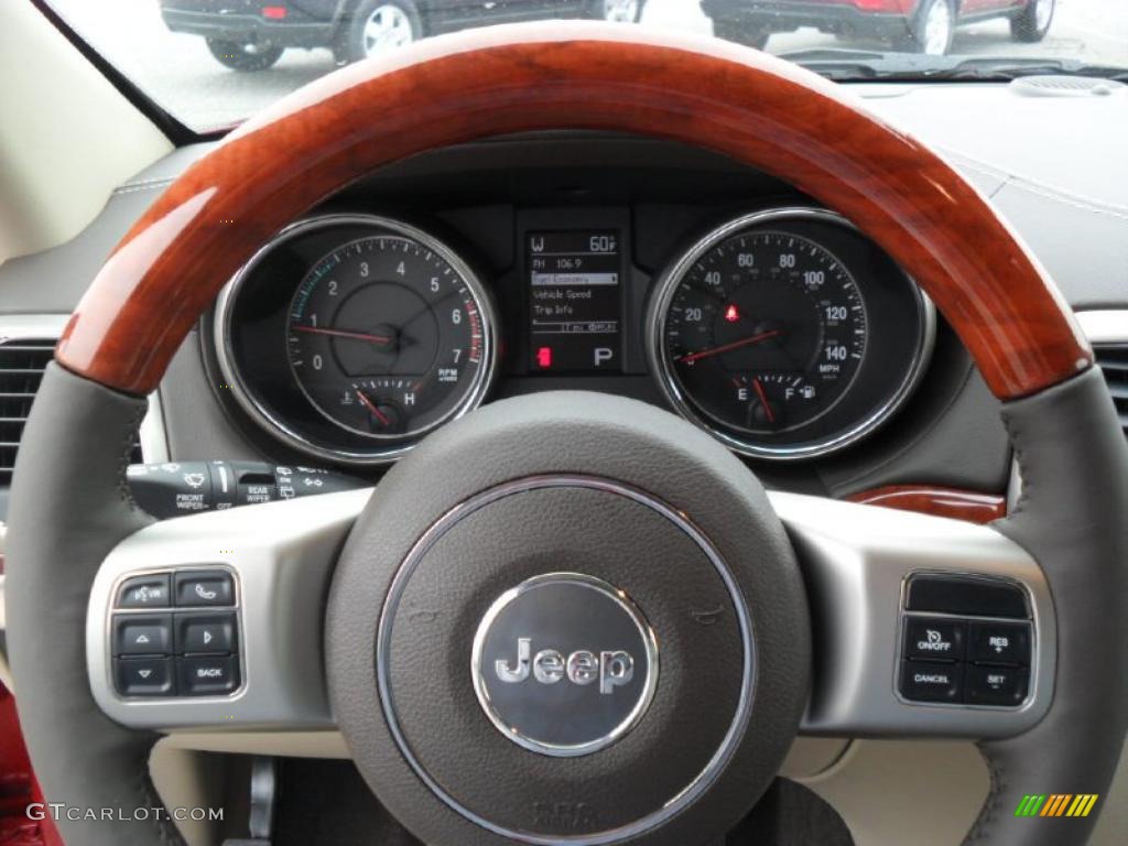2011 Jeep Grand Cherokee Overland 4x4 Dark Frost Beige/Light Frost Beige Steering Wheel Photo #39186063