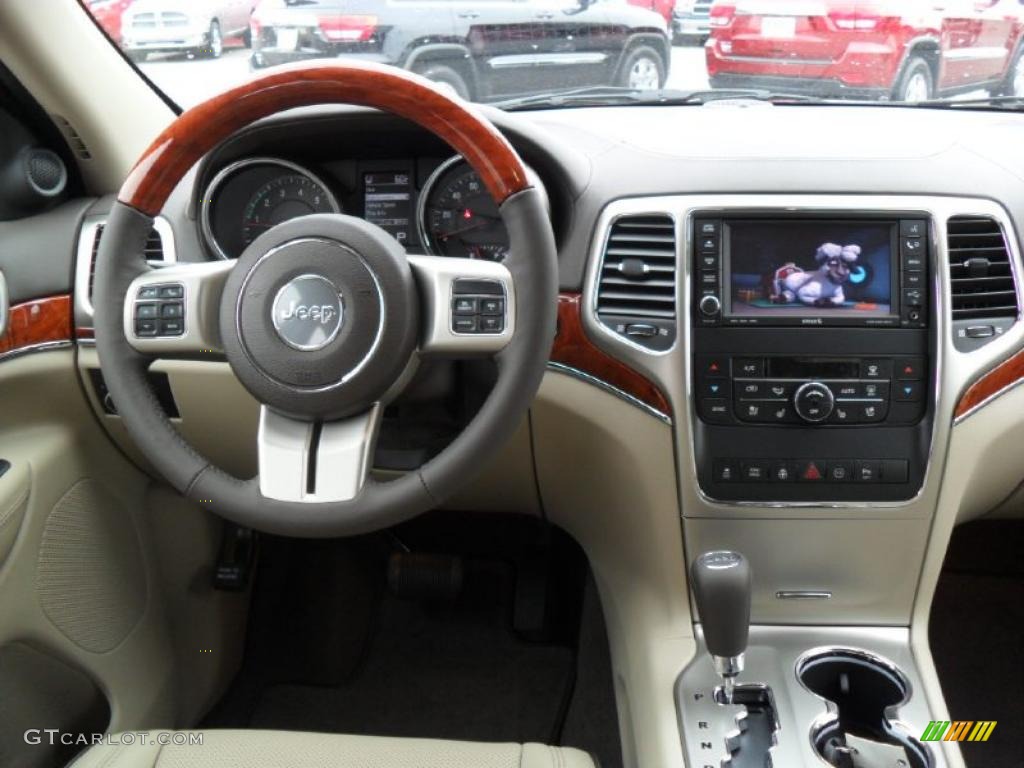 2011 Jeep Grand Cherokee Overland 4x4 Dark Frost Beige/Light Frost Beige Dashboard Photo #39186227