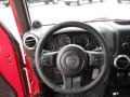 Black 2011 Jeep Wrangler Unlimited Rubicon 4x4 Steering Wheel