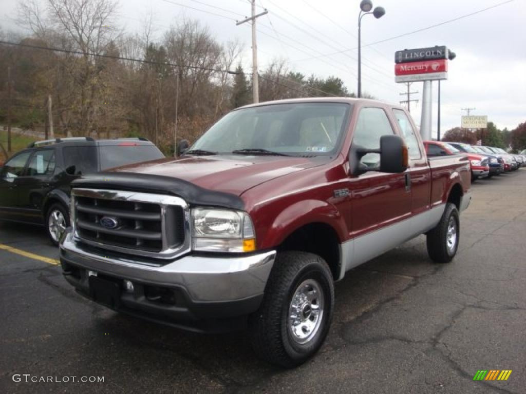 2004 F250 Super Duty XLT SuperCab 4x4 - Dark Toreador Red Metallic / Medium Flint photo #1