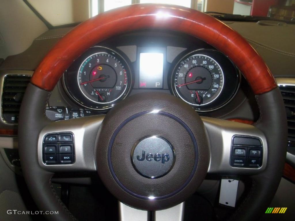 2011 Jeep Grand Cherokee Overland 4x4 Dark Frost Beige/Light Frost Beige Steering Wheel Photo #39415405