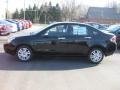 2011 Ebony Black Ford Focus SEL Sedan  photo #1