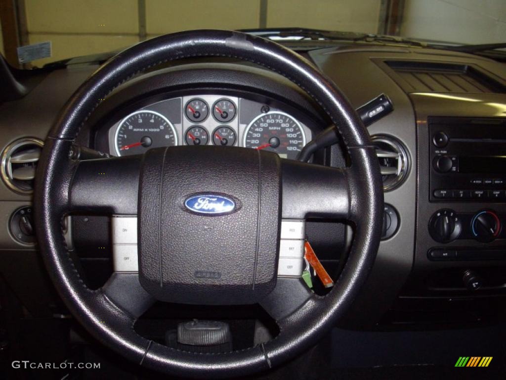 2005 Ford F150 FX4 SuperCab 4x4 Black Steering Wheel Photo #39712439