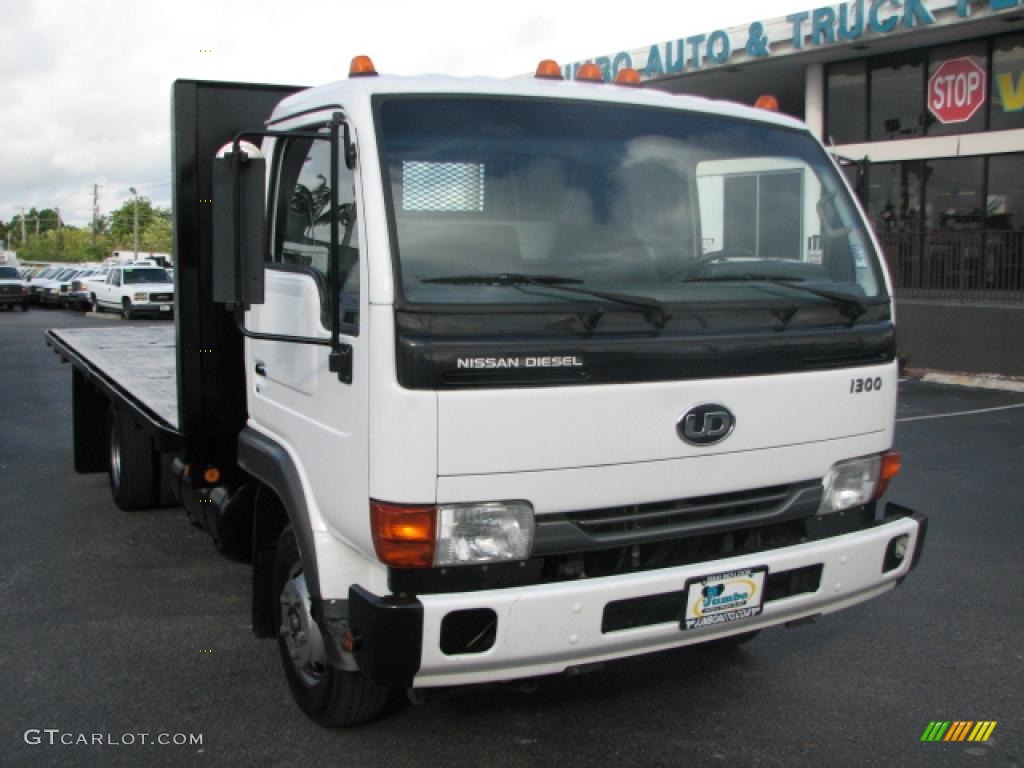 White 2006 Nissan Diesel UD 1300 Flat Bed Stake Truck Exterior Photo #39764342