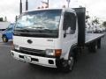 White - UD 1300 Flat Bed Stake Truck Photo No. 3