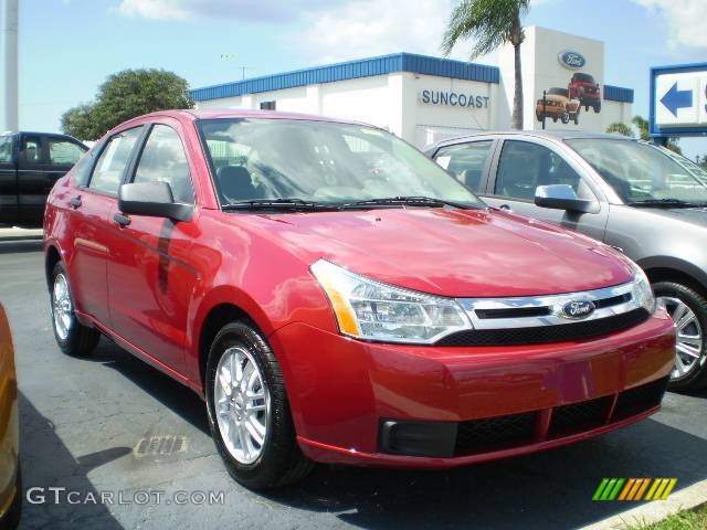 2009 Focus SE Sedan - Sangria Red Metallic / Medium Stone photo #1