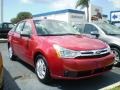 2009 Sangria Red Metallic Ford Focus SE Sedan  photo #1