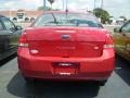 2009 Sangria Red Metallic Ford Focus SE Sedan  photo #4