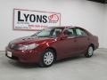 2005 Salsa Red Pearl Toyota Camry LE  photo #27