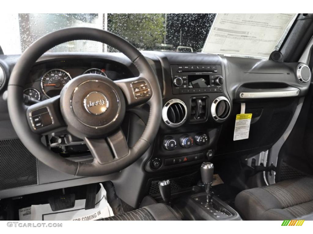 Black Interior 2011 Jeep Wrangler Unlimited Sahara 4x4 Photo #40450625