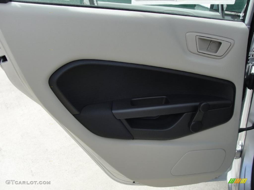 2011 Ford Fiesta S Sedan Light Stone/Charcoal Black Cloth Door Panel Photo #40542257