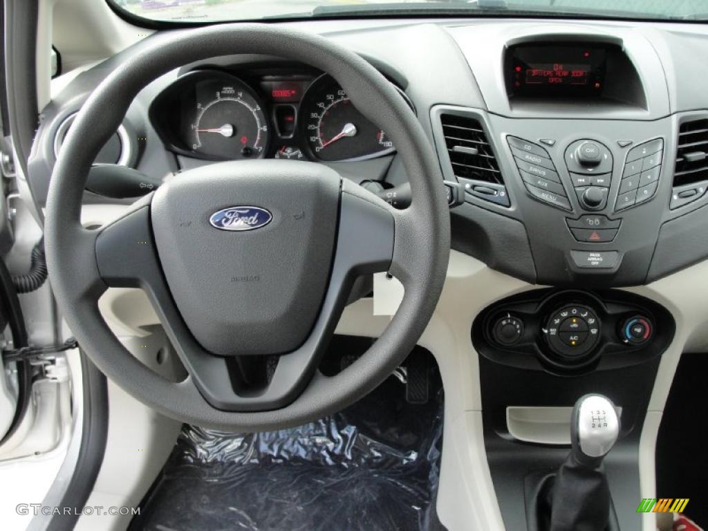 2011 Ford Fiesta S Sedan Light Stone/Charcoal Black Cloth Dashboard Photo #40542369
