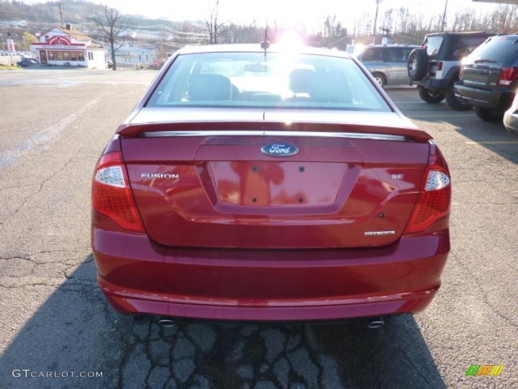 2011 Fusion SE V6 - Red Candy Metallic / Medium Light Stone photo #3