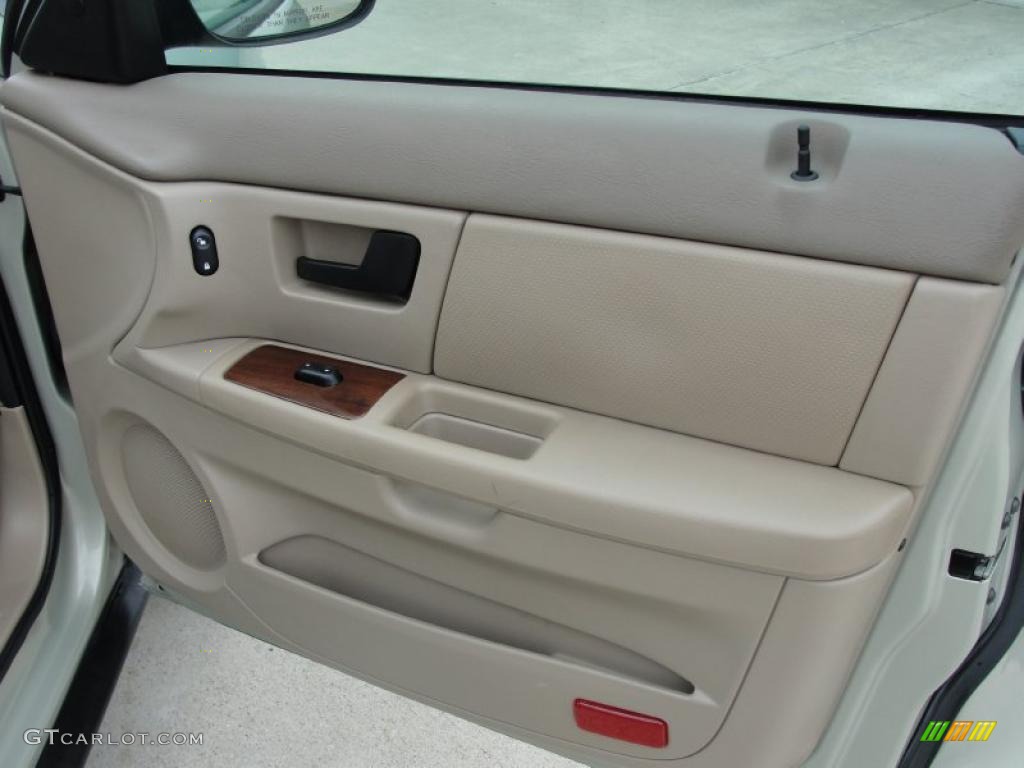 2005 Ford Taurus SEL Medium/Dark Pebble Door Panel Photo #40718690