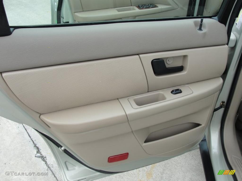 2005 Ford Taurus SEL Medium/Dark Pebble Door Panel Photo #40718786