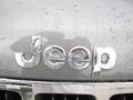 2011 Jeep Grand Cherokee Laredo X Package 4x4 Badge and Logo Photo