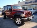 2010 Red Rock Crystal Pearl Jeep Wrangler Unlimited Sport  photo #30