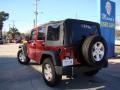 2010 Red Rock Crystal Pearl Jeep Wrangler Unlimited Sport  photo #31