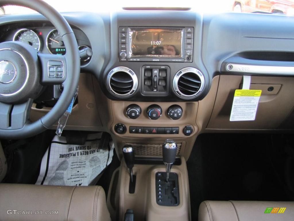 2011 Jeep Wrangler Unlimited Sahara 4x4 Black/Dark Saddle Dashboard Photo #41141455