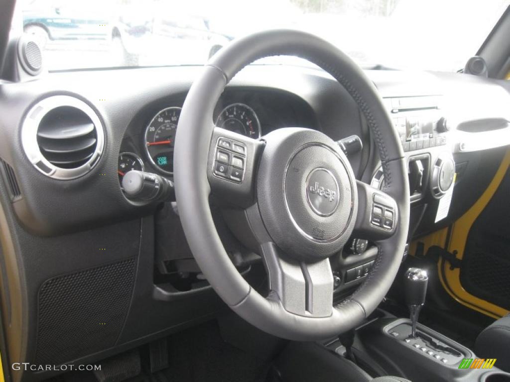 2011 Jeep Wrangler Unlimited Sahara 4x4 Black Steering Wheel Photo #41249821
