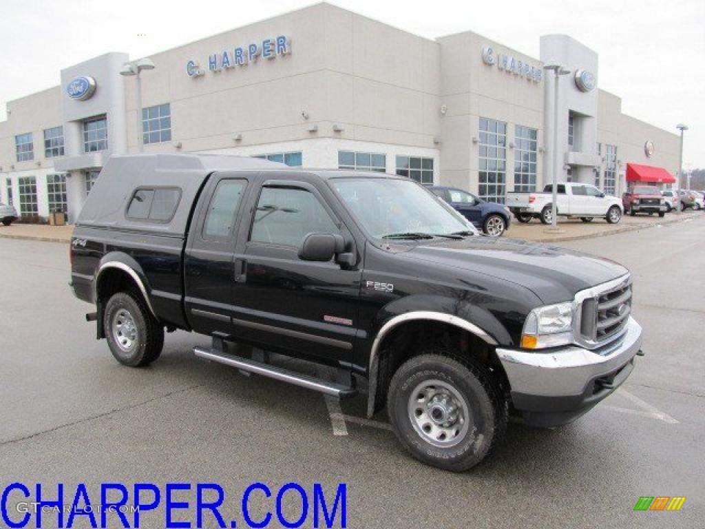 2004 F250 Super Duty XLT SuperCab 4x4 - Black / Medium Flint photo #1
