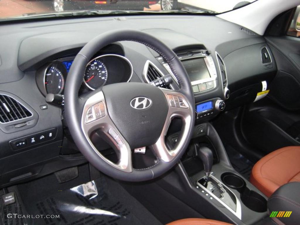 Black/Saddle Interior 2011 Hyundai Tucson Limited AWD Photo #41606145