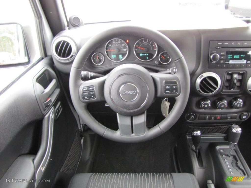 2011 Jeep Wrangler Unlimited Sahara 4x4 Black Steering Wheel Photo #41824187