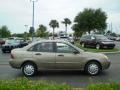 2005 Arizona Beige Metallic Ford Focus ZX4 SES Sedan  photo #2