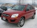 2010 Volcanic Red Kia Sportage LX V6 4x4  photo #1