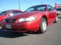 1999 Laser Red Metallic Ford Mustang V6 Coupe  photo #1