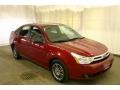 2010 Sangria Red Metallic Ford Focus SE Sedan  photo #1