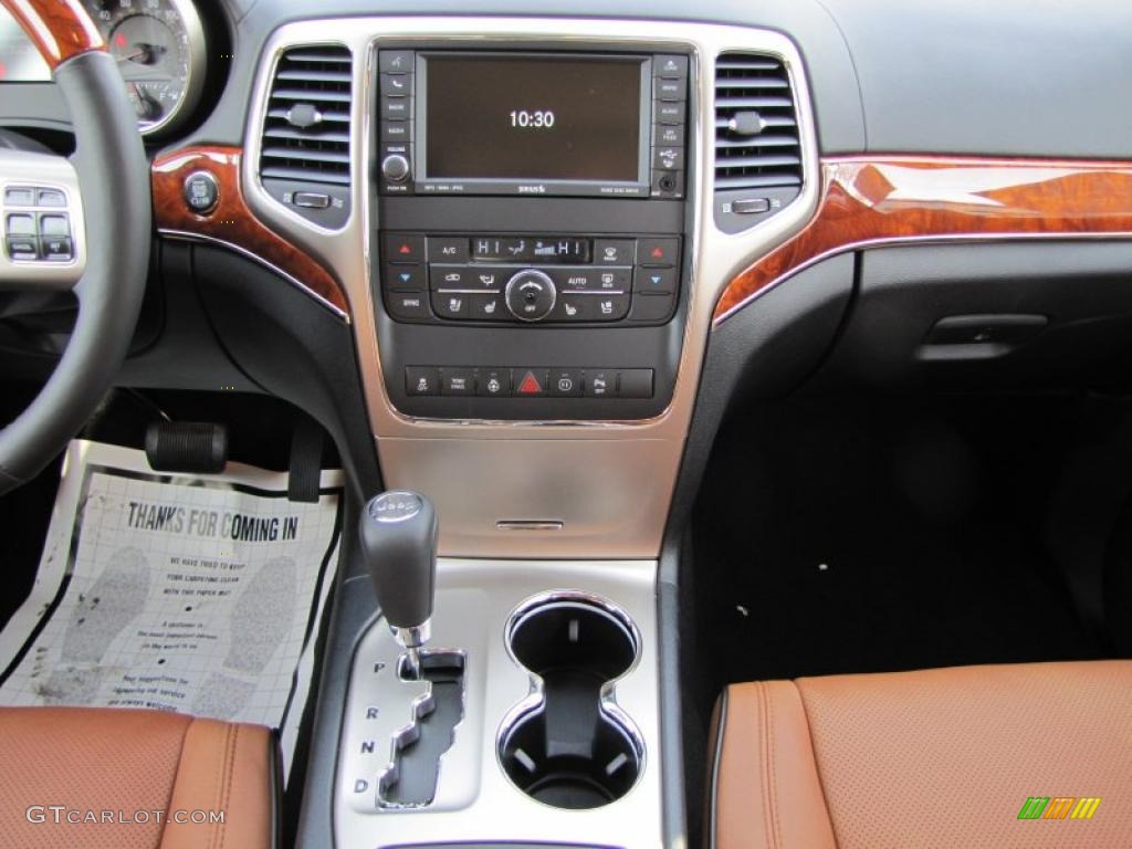 2011 Jeep Grand Cherokee Overland New Saddle/Black Dashboard Photo #42135183