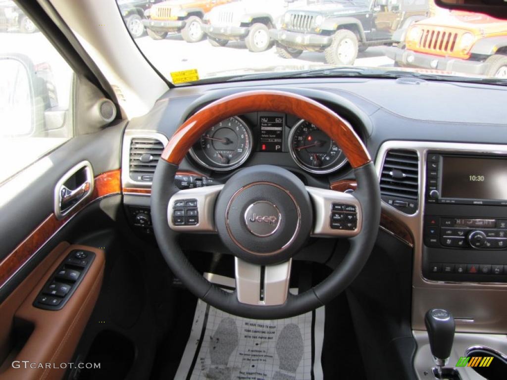2011 Jeep Grand Cherokee Overland New Saddle/Black Steering Wheel Photo #42135199