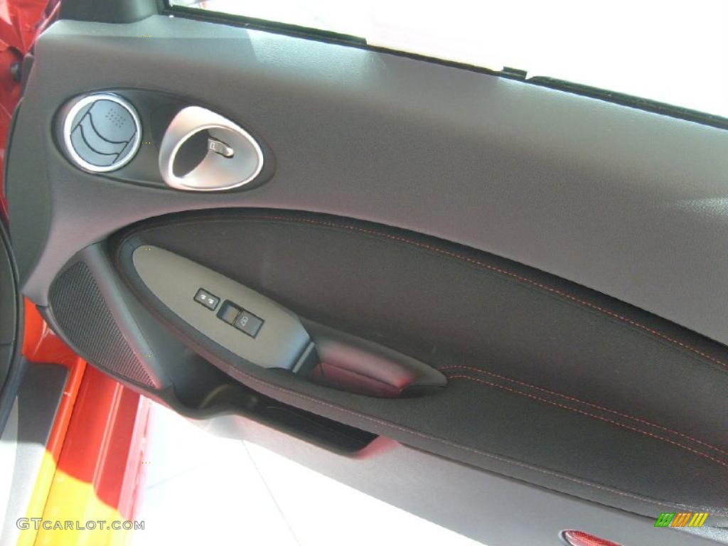 2010 Nissan 370Z NISMO Coupe NISMO Black/Red Cloth Door Panel Photo #42199399