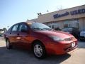 2003 Sangria Red Metallic Ford Focus SE Sedan  photo #2