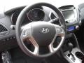 2011 Hyundai Tucson Black/Saddle Interior Steering Wheel Photo