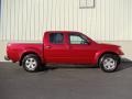 Red Brick 2010 Nissan Frontier SE Crew Cab 4x4 Exterior