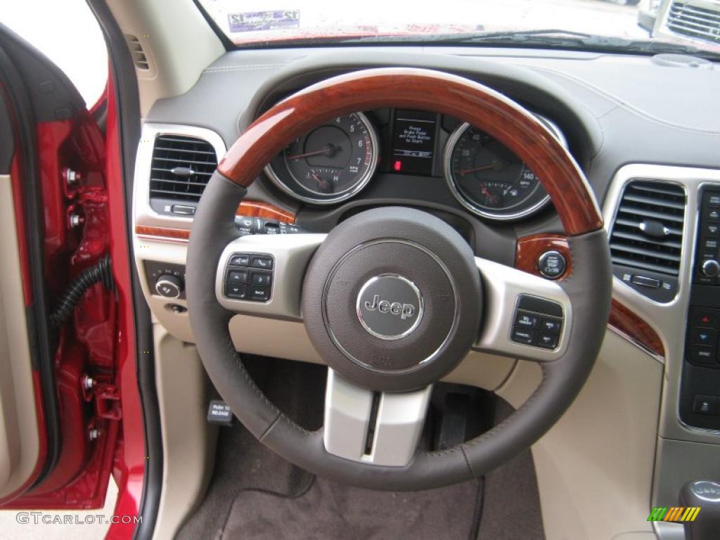 2011 Jeep Grand Cherokee Overland Dark Frost Beige/Light Frost Beige Steering Wheel Photo #43118616