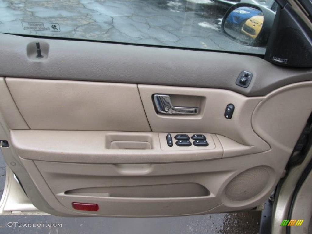 2000 Ford Taurus SEL Medium Parchment Door Panel Photo #43888656