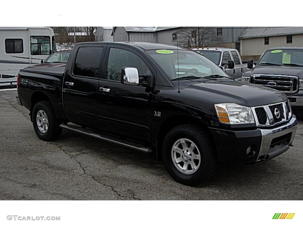 2004 Titan LE Crew Cab 4x4 - Galaxy Black / Sand/Steel photo #1