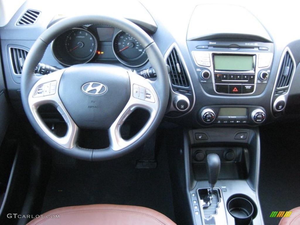 2011 Hyundai Tucson Limited AWD Black/Saddle Dashboard Photo #44439170