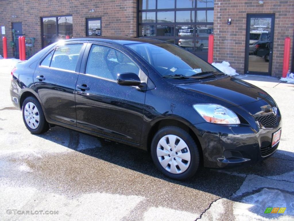 2010 Yaris Sedan - Black Sand Pearl / Bisque photo #1