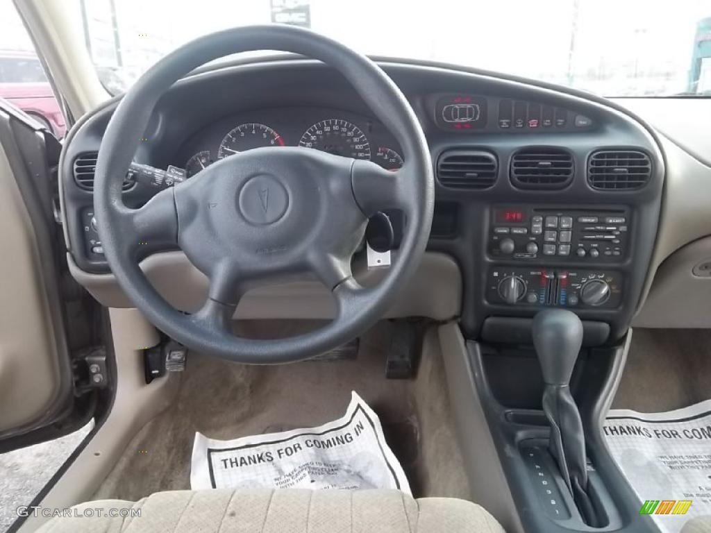 2002 Grand Prix SE Sedan - Dark Bronzmist Metallic / Dark Taupe photo #21