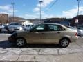 2000 Fort Knox Gold Metallic Ford Focus SE Sedan  photo #6