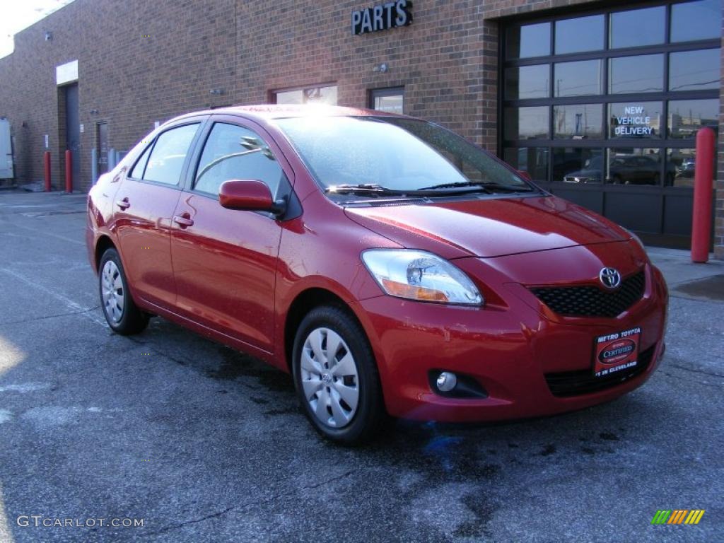 2010 Yaris Sedan - Barcelona Red Metallic / Bisque photo #1