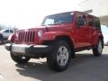 2011 Flame Red Jeep Wrangler Unlimited Sahara 4x4  photo #7