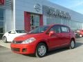 2011 Red Alert Nissan Versa 1.8 S Hatchback  photo #1